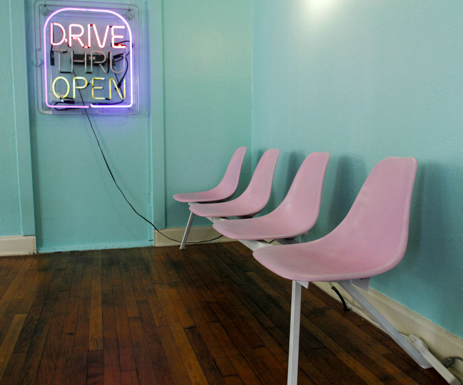 Seating and an old Taco Bell drive thru sign